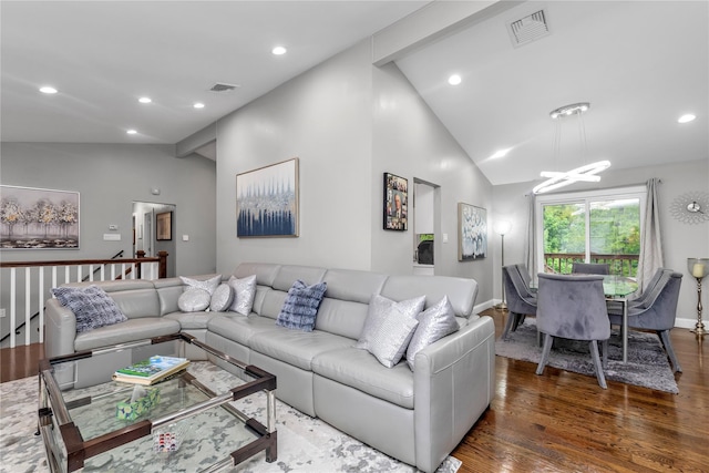 living area with wood finished floors, a chandelier, recessed lighting, baseboards, and high vaulted ceiling