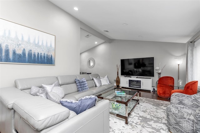 living area with lofted ceiling, wood finished floors, and recessed lighting
