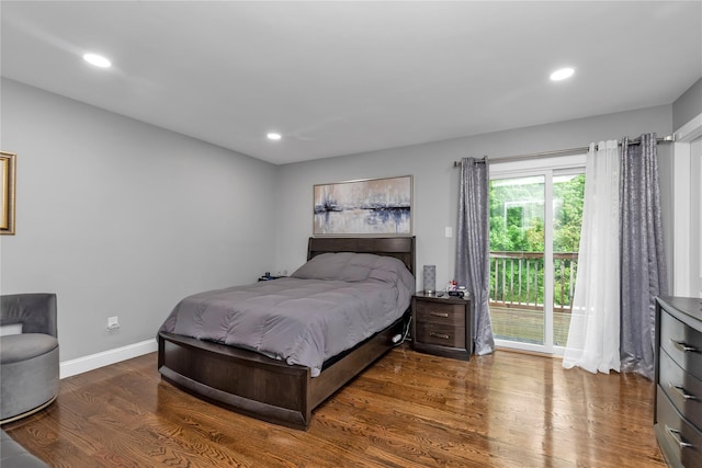 bedroom featuring wood finished floors, access to outside, baseboards, and recessed lighting