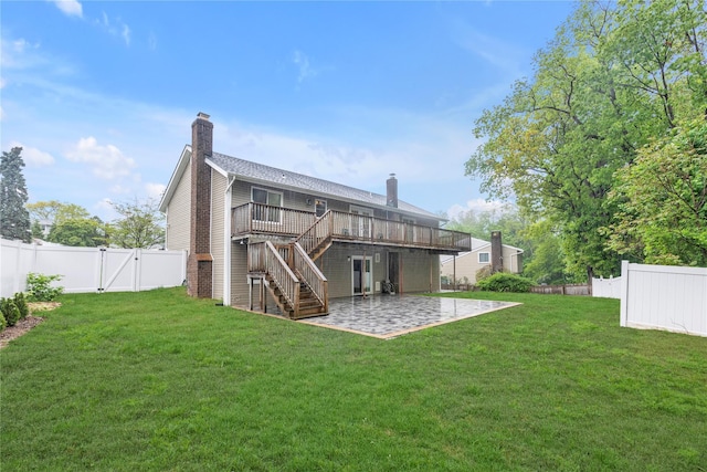 back of property featuring a chimney, a patio, a gate, stairs, and a wooden deck