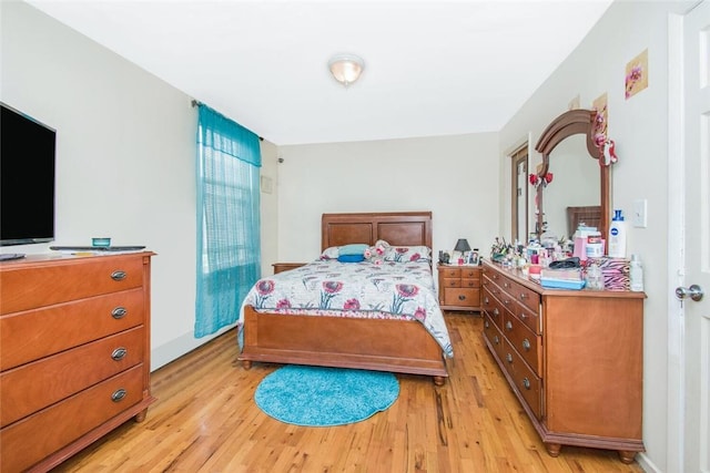 bedroom with light wood-style floors