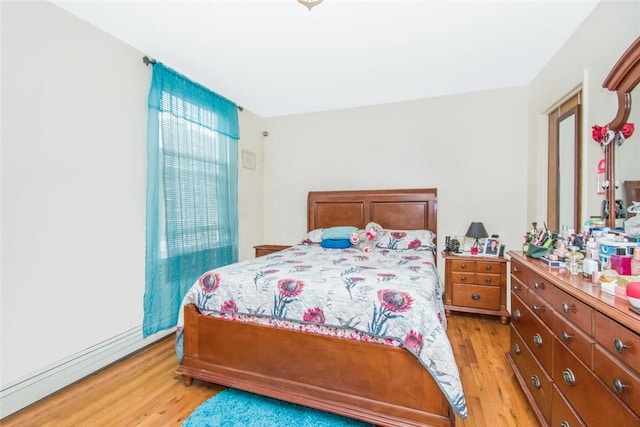 bedroom with light wood-type flooring