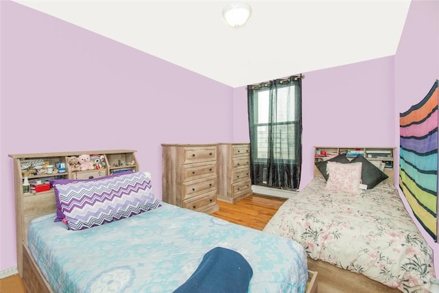 bedroom with wood finished floors