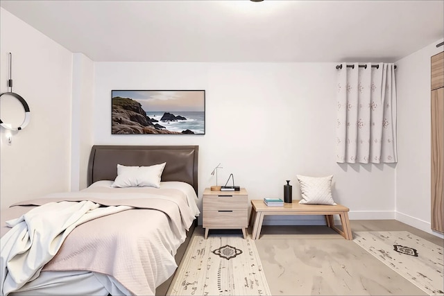 bedroom featuring baseboards
