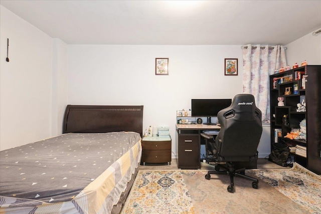 bedroom with wood finished floors