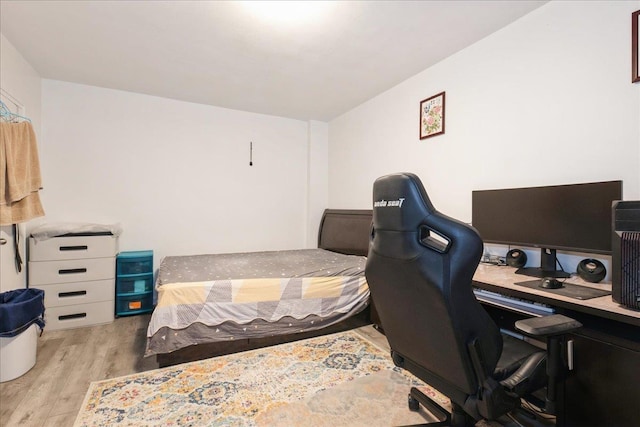bedroom featuring wood finished floors