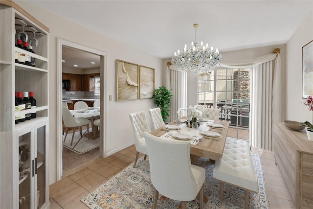 216 Maple Ave, Monroe, NY 10950 - dining space featuring a chandelier, light tile patterned floors, and baseboards