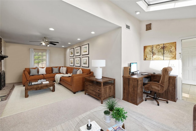 216 Maple Ave, Monroe, NY 10950 - living room featuring light carpet, an office area, recessed lighting, a skylight, and a fireplace
