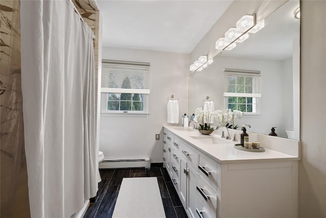 216 Maple Ave, Monroe, NY 10950 - bathroom featuring baseboard heating, double vanity, toilet, and a shower with curtain