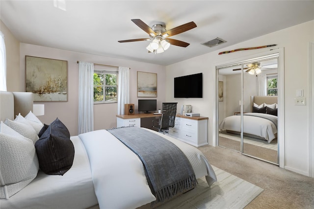 216 Maple Ave, Monroe, NY 10950 - bedroom featuring light colored carpet, an office area, a ceiling fan, and a closet