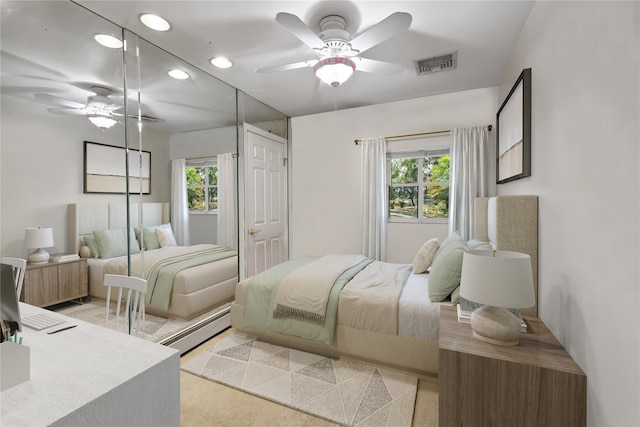 216 Maple Ave, Monroe, NY 10950 - bedroom featuring multiple windows, recessed lighting, a baseboard radiator, and a ceiling fan