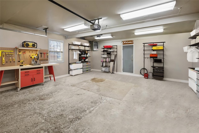 216 Maple Ave, Monroe, NY 10950 - garage featuring a workshop area, a garage door opener, and baseboards
