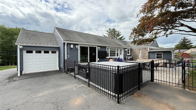 125 Kings Hwy, Congers, NY 10920 - view of front of property with a garage, a gate, a chimney, and asphalt driveway