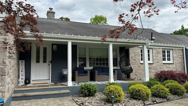 125 Kings Hwy, Congers, NY 10920 - view of front of property with a shingled roof, a porch, stone siding, and a chimney