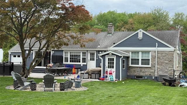 125 Kings Hwy, Congers, NY 10920 - rear view of house with a chimney, a patio area, a shingled roof, and stone siding