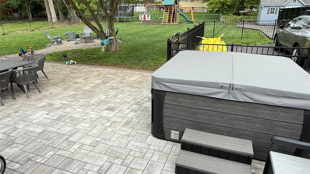 125 Kings Hwy, Congers, NY 10920 - view of patio with a hot tub, a trampoline, a playground, outdoor dining area, and an outdoor fire pit