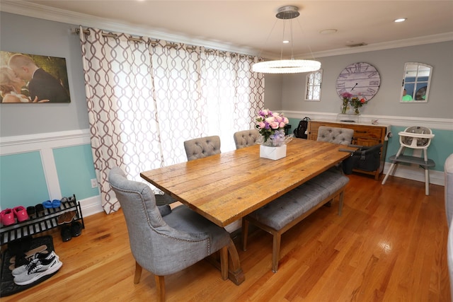 125 Kings Hwy, Congers, NY 10920 - dining room with light wood finished floors, a wainscoted wall, and ornamental molding