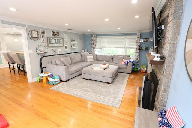 125 Kings Hwy, Congers, NY 10920 - living room featuring crown molding, wood finished floors, recessed lighting, and a stone fireplace