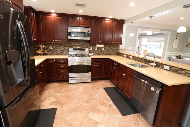 125 Kings Hwy, Congers, NY 10920 - kitchen with stainless steel appliances, a sink, decorative backsplash, a peninsula, and pendant lighting