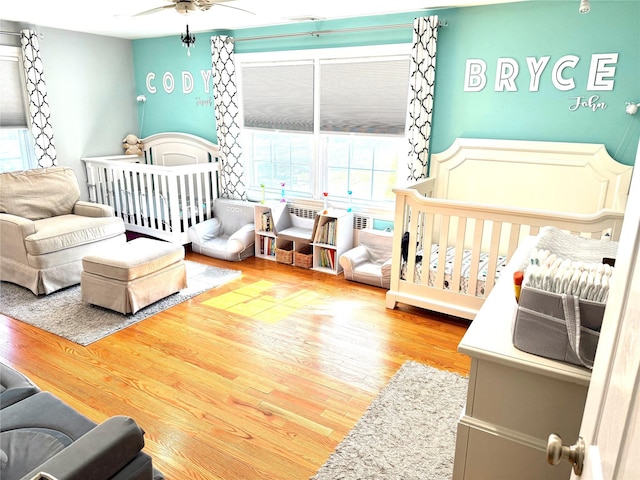 125 Kings Hwy, Congers, NY 10920 - bedroom featuring wood finished floors and a crib