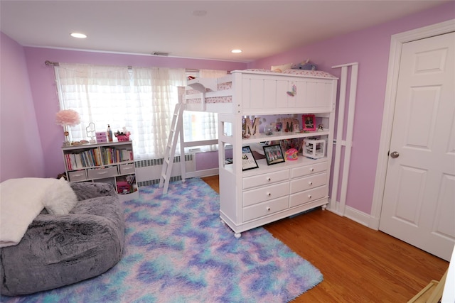 125 Kings Hwy, Congers, NY 10920 - bedroom with radiator, wood finished floors, and recessed lighting