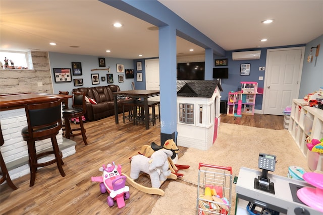 125 Kings Hwy, Congers, NY 10920 - game room featuring wood finished floors, recessed lighting, and an AC wall unit