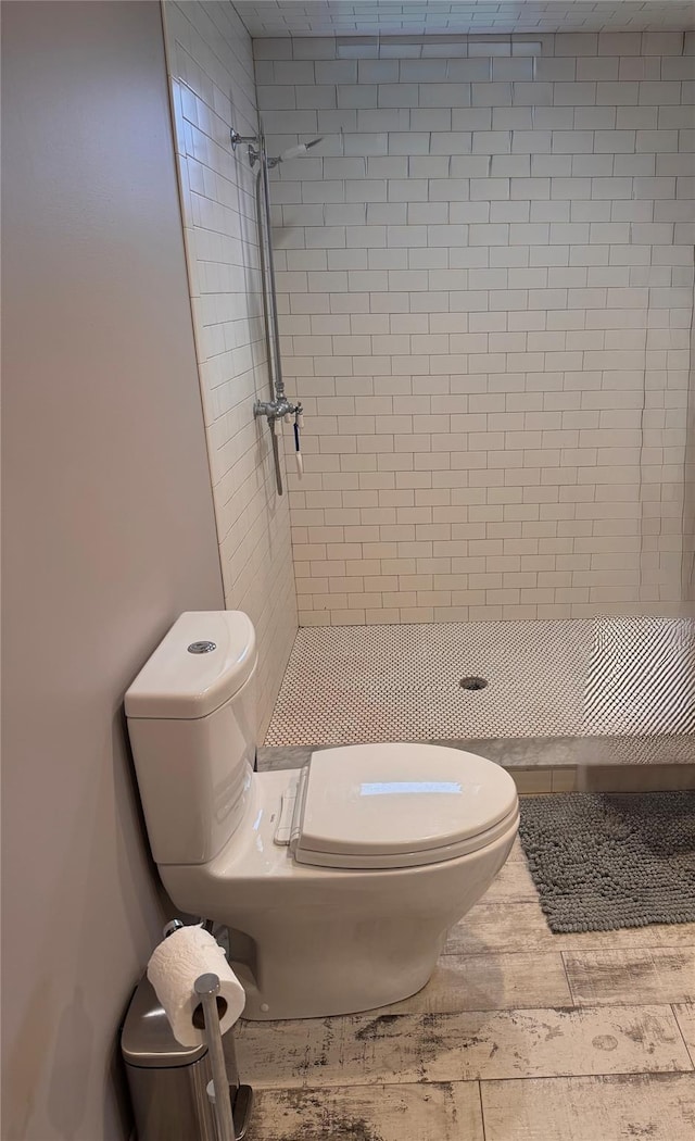 125 Kings Hwy, Congers, NY 10920 - full bathroom featuring toilet, tiled shower, and wood finished floors