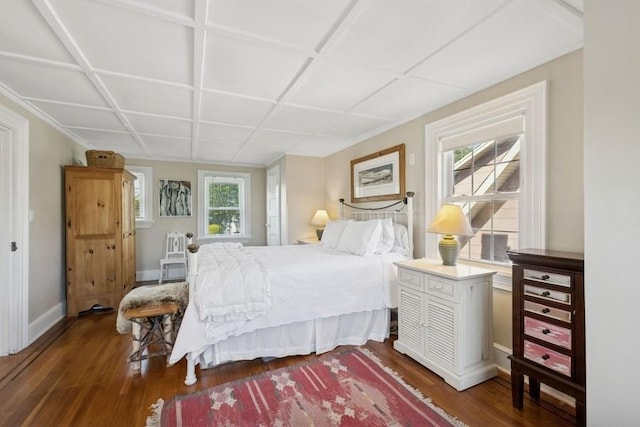 bedroom with wood finished floors and baseboards