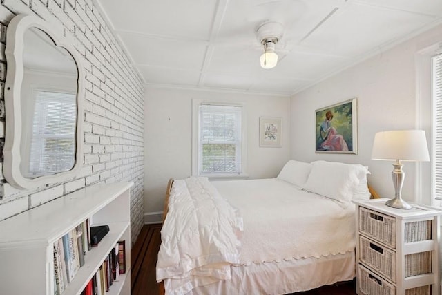 bedroom with dark wood-type flooring and crown molding