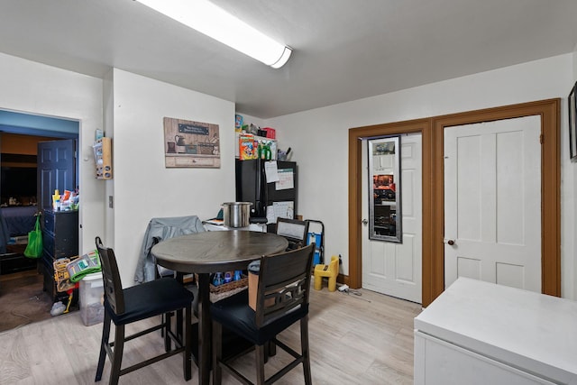 dining room with light wood-style flooring