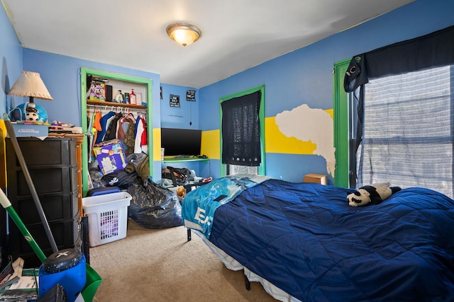 bedroom with a closet and carpet floors