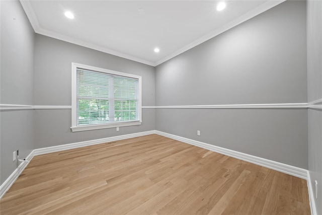 unfurnished room featuring baseboards, wood finished floors, ornamental molding, and recessed lighting