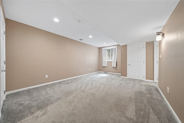 carpeted spare room with baseboards and recessed lighting