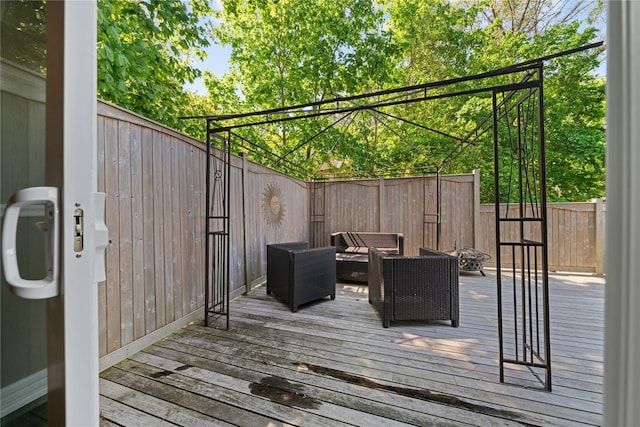 deck with fence and an outdoor living space