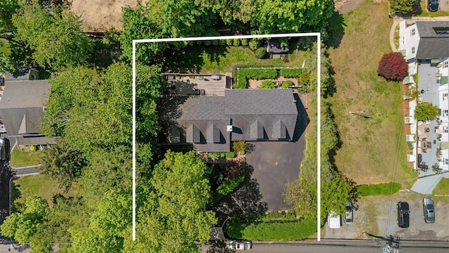 aerial view of property and surrounding area featuring property parcel outlined