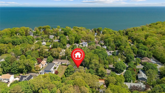 aerial perspective of suburban area featuring a nearby body of water
