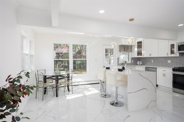 kitchen featuring stainless steel appliances, glass insert cabinets, light stone countertops, recessed lighting, and tasteful backsplash