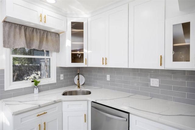 kitchen with stainless steel dishwasher and white cabinets
