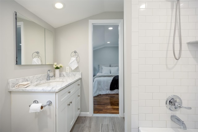 full bath with vanity, tub / shower combination, lofted ceiling, ensuite bath, and recessed lighting