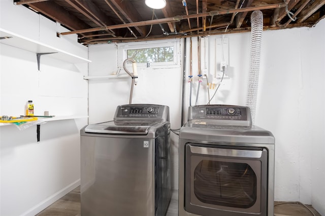 laundry room with washing machine and clothes dryer