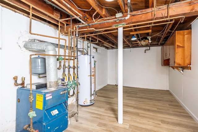 unfinished basement featuring water heater, a heating unit, and wood finished floors