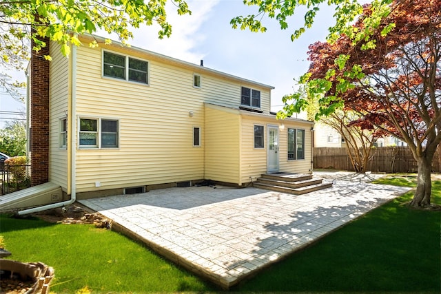 back of house featuring a patio and a chimney