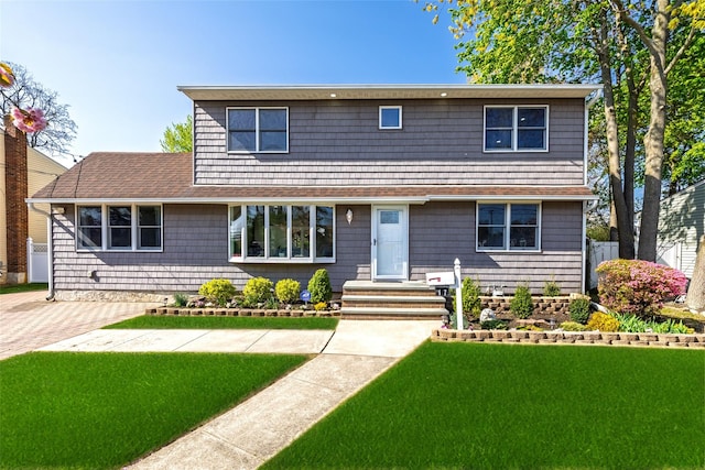 view of front of home with a front lawn