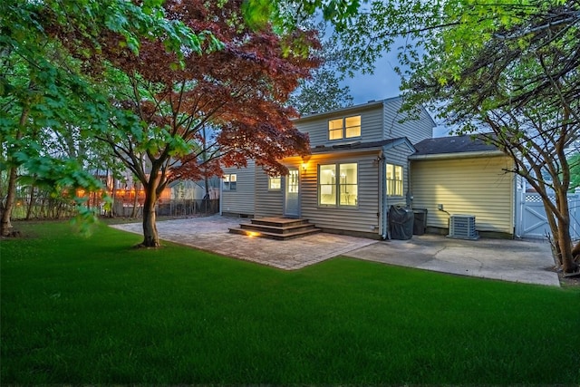 back of house with a patio area and central AC