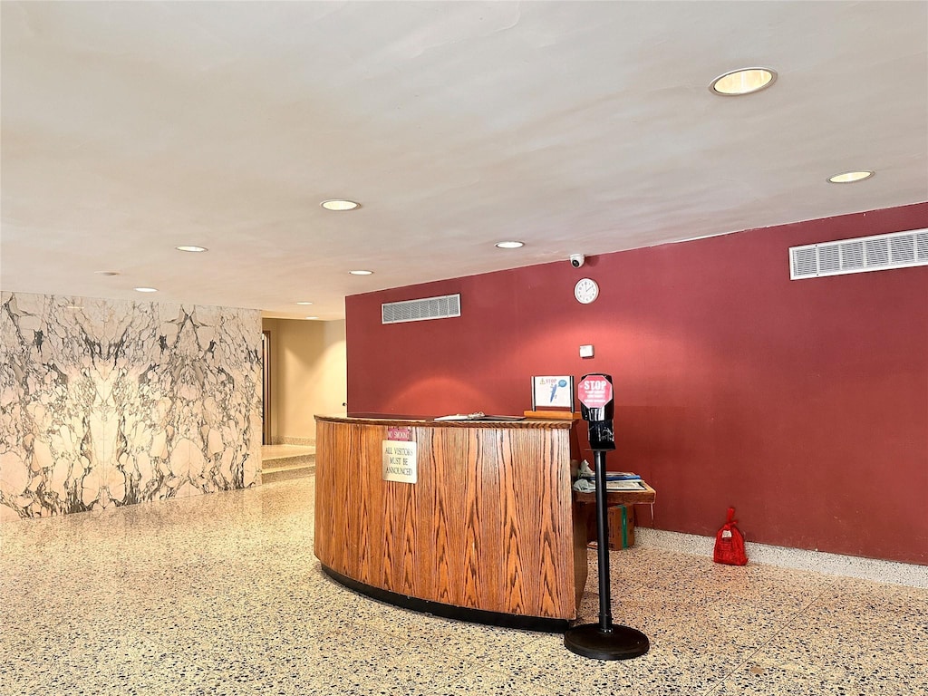 reception area with a bar and visible vents