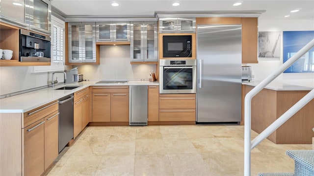 575 Dune Rd Unit 36And 37, Westhampton Beach, NY 11978 - kitchen featuring built in appliances, a sink, light countertops, glass insert cabinets, and recessed lighting