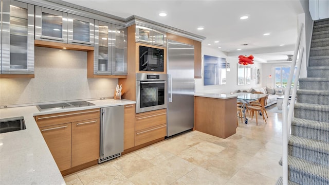 575 Dune Rd Unit 36And 37, Westhampton Beach, NY 11978 - kitchen with black appliances, glass insert cabinets, a peninsula, open floor plan, and backsplash