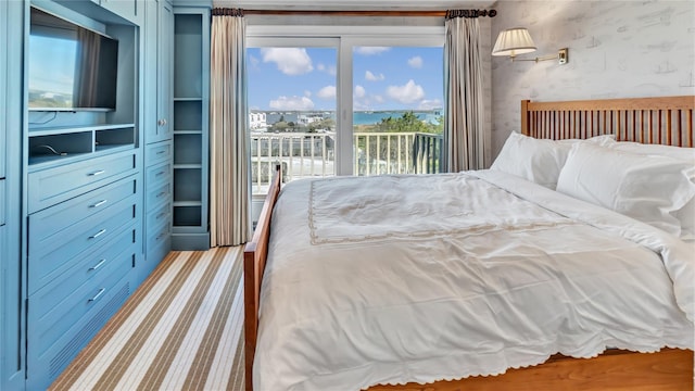 575 Dune Rd Unit 36And 37, Westhampton Beach, NY 11978 - bedroom featuring access to exterior and wallpapered walls