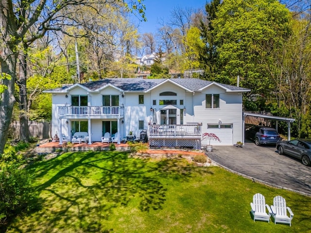 60 Bayview Dr, Huntington, NY 11743 - view of front facade featuring driveway, a garage, a deck, a front lawn, and a carport