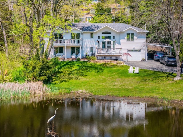 60 Bayview Dr, Huntington, NY 11743 - back of property featuring aphalt driveway, an attached garage, a yard, a carport, and a water view